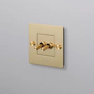 BUSTER + PUNCH® EU - 1G DOUBLE TOGGLE SWITCH brass